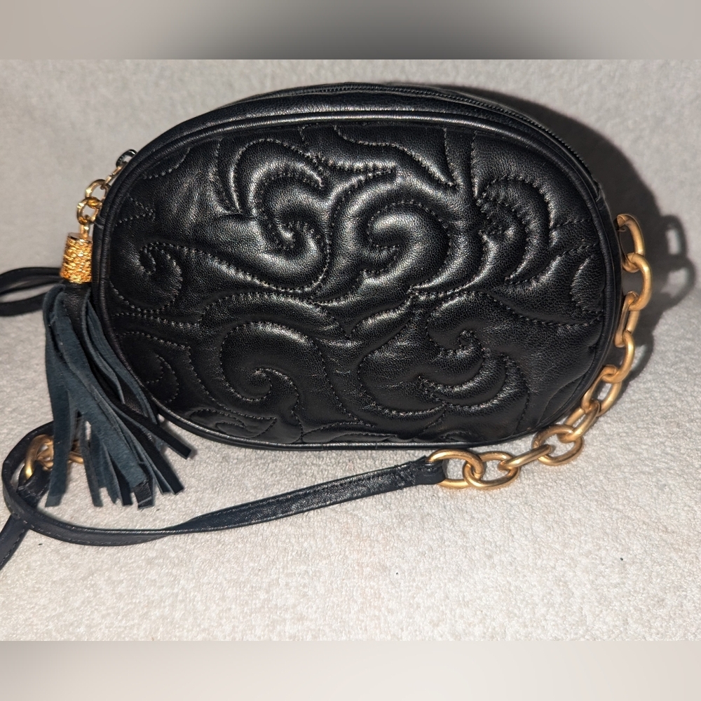 LJS Collection black quilted crossbody bag.